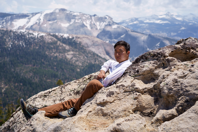 Mark Xu sitting in the mountains